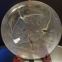 Front view of the Verlys moulded glass charger showing the bird design