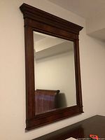 Front view of full mirror showing rectangular frame and crown molding