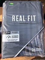 Close up of sealed pack of Depend Real Fit adult underwear, size L/XL with 26 count.