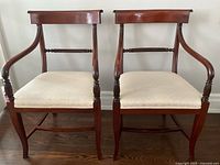 Front view of both chairs side by side showing frames and upholstery