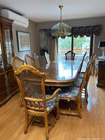 Full view of table and chairs assembled in dining area