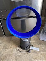 Front view of fan showing blue loop amplifier, gray base, power cord