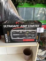 Front of retail box showing NOCO Boost Pro GB150 branding, 12V 3000A spec and product image