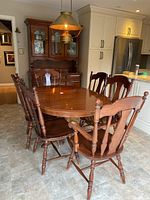 Dining room setup showing oval table and six chairs