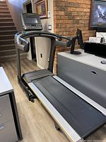 Front side view showing entire treadmill including belt and console