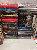 Photo of stacked spine titles showing some book titles in the lot