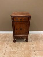 Full view of the vintage antique side table showing the wood finish and design.