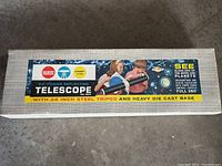 Box showing vintage Gilbert 60-power reflecting telescope with images of planets and moon, description of features.