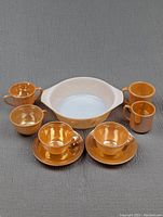 Overview of all Fire King items including swirl bowl, sugar bowl, cups, saucers, and mugs shown from the front and top angles.