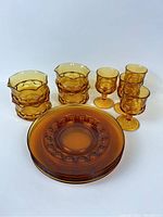 View of the complete set showing all pieces including plates, goblets, and bowls.