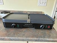 Hamilton Beach electric grill griddle showing front with knobs and indicator lights