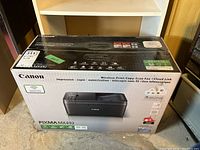 Photo of the sealed Canon PIXMA MX492 box, showing the product branding, model number, and product image.