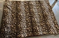 Photo showing the full leopard print plush throw laid out flat, showcasing the pattern and texture.
