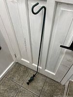 Full view of the long reach vice grip tool, showing the rod and grip hook handle.