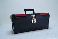 Closed black plastic toolbox with metal latch and handle