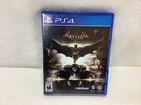 Front cover of the PS4 Batman Arkham Knight video game case showing title and artwork.