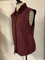 Side view of Denver Hayes sherpa lined cabernet winter vest showing sleeveless design and collar.