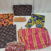 Lot of assorted fabric bags from the 1970s showing patterns, colors and styles.