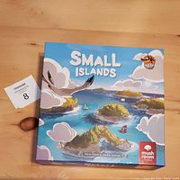 Photo of the front of the Small Islands board game box showing colorful illustrated islands and the game title.