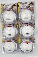 Front view of six McCordick N95 particulate respirator masks in sealed packaging, showing white masks with exhalation valves.