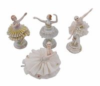 All four Luigi Fabris mini lace porcelain ballerina figurines arranged together showing various poses and detailed lace skirts.