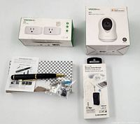 All items shown: VOCOlinc VC1 Camera box, Smart Bar Wi-Fi Plugs box (2-pack), spy pen with accessories, wireless Bluetooth audio receiver boxed
