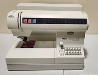 Front view of PFAFF Tiptronic 6230 sewing machine showing stitch pattern buttons and dials, visible minor wear marks.