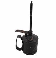 Side angle showing metal oil can with cylindrical body, handle, long spout, push lever and cap on top, embossed with brand and location.