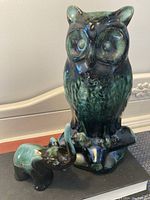 Blue Mountain Pottery owl and elephant figurines displayed together on a surface.