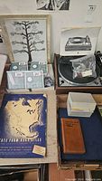 Overall lot overview showing turntable, Jaz cartridges, atlas, notebook, frame and slide mounts