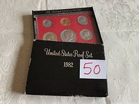 1982 United States Proof Set in plastic case next to original black cardboard holder with white sticker indicating '50'