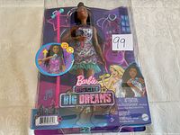 Front view of the new Barbie Big City Big Dreams doll in original packaging showing the doll and included accessories