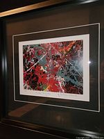 Framed Jackson Pollock Number Thirty One art print showing detail of the abstract expressionist painting and the handwritten title and artist name.