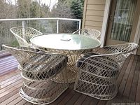 Full view of round table and four chairs on deck