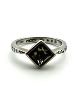 Close-up front view showing the square faceted gemstone and the sterling silver band engraved with "HARLEY DAVIDSON" text.
