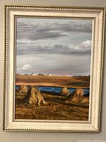 Front view of the framed acrylic painting showing the rural landscape and cloudy sky, with sheaves of wheat in the foreground.