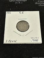 Front (reverse) of 1916 Great Britain 3 Pence coin showing decorative number 3 and the year 1916