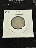 Obverse side of 1930 Buffalo Nickel showing Native American profile and date.