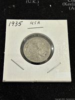 Obverse side of the 1935 Buffalo Nickel, showing the Native American profile.