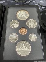 Proof condition Canadian coins set from 1983 with various denominations displayed in a black presentation case.