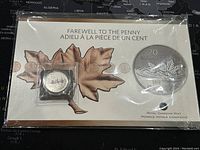 Front view of the sealed 2012 Farewell to the Penny $20 silver coin package with maple leaf design and bilingual text.