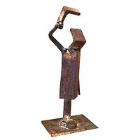 Full view of small torch cut and welded steel figure sculpture on base; showing rusty patina and welds.
