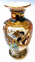 Angle view of the antique Satsuma vase showing detailed hand-painted figures and gold accents on body and neck