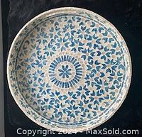 Top view of large blue and white ceramic tray with detailed blue floral and geometric design.