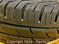 Close-up photo showing tread pattern and sidewall condition of Continental winter tire, highlighting deep tread and no damage.
