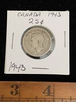 Obverse side of the 1943 Canadian 25 cent coin showing King George VI portrait.