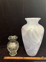 Both vases side by side with ruler showing size, smaller etched cornflower vase with ruffled edge and larger opaque art glass vase