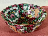 Side view showing detailed painted scenes and floral motifs in Famille Rose palette.