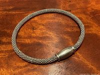 Full view of the Italian silver mesh bracelet laid flat showing the mesh texture and magnetic clasp.