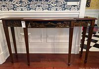 Front view of console table showing overall design and condition